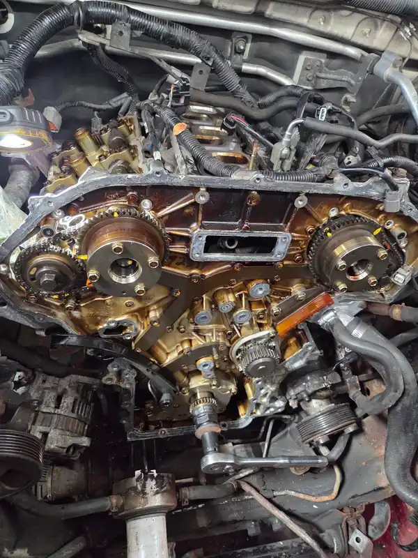 Engine timing chains and sprockets exposed during workshop service at NOFO
